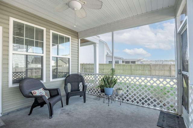 sunroom / solarium with ceiling fan