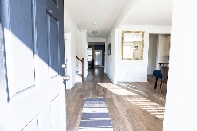 interior space featuring crown molding and dark hardwood / wood-style floors