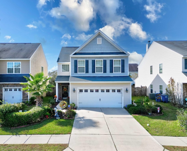 view of front of home with a garage and a front lawn