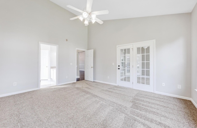 unfurnished room featuring high vaulted ceiling, carpet, and ceiling fan