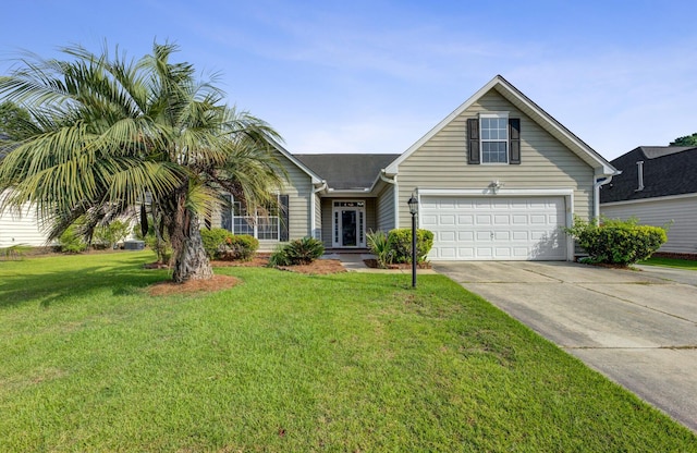 view of front of home featuring a garage and a front lawn