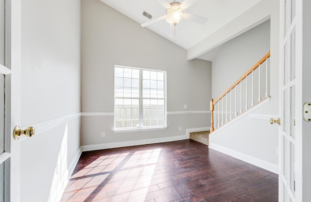 entryway featuring ceiling fan, vaulted ceiling, and dark hardwood / wood-style flooring