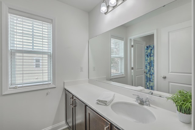 bathroom featuring vanity and a wealth of natural light