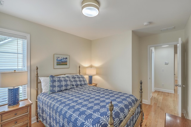 bedroom with light wood-type flooring