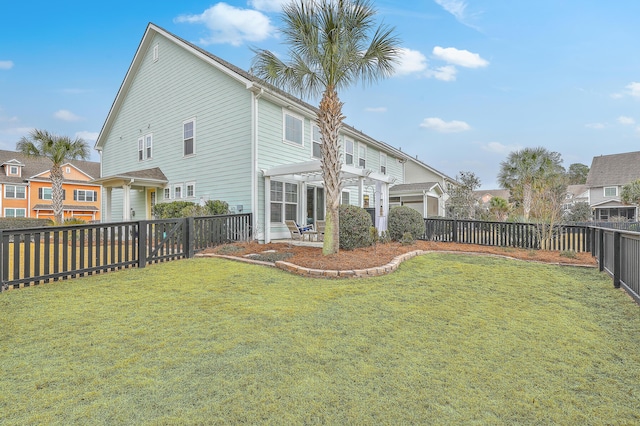 back of property with a yard and a pergola