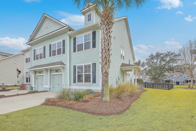 view of front of home featuring a garage and a front yard