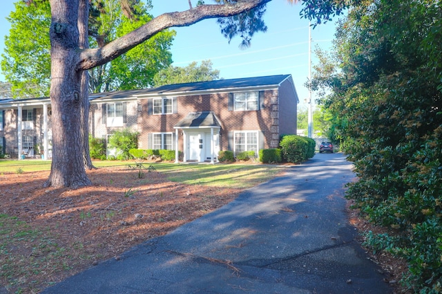 view of front of home with brick siding