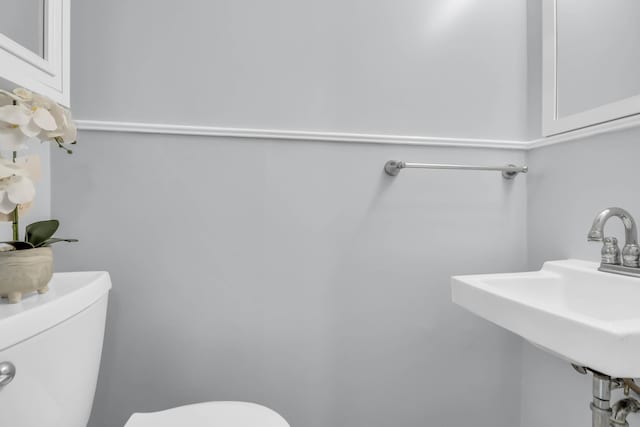 bathroom featuring toilet and a sink