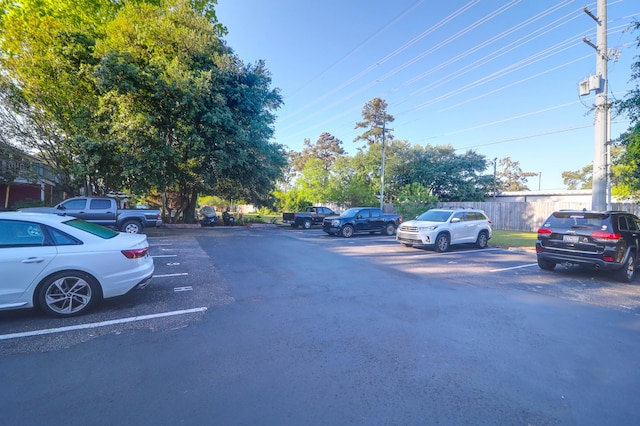 uncovered parking lot with fence