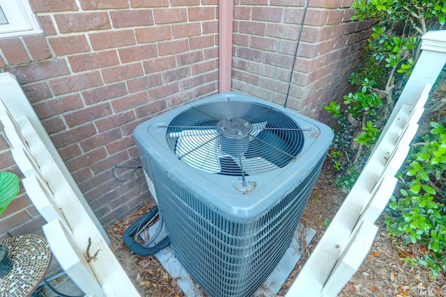 exterior view of central air condition unit and brick siding