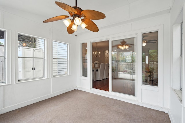 unfurnished sunroom featuring carpet floors