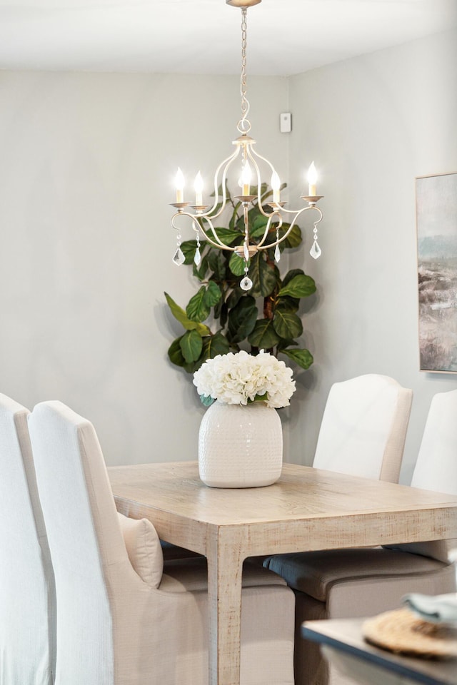 dining space with a chandelier