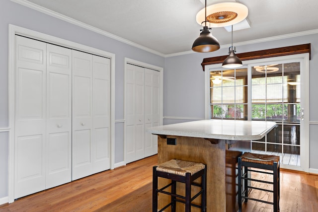 4075 Brown St, Orangeburg, SC 29118 - dining room with light wood-type flooring, crown molding, and baseboards