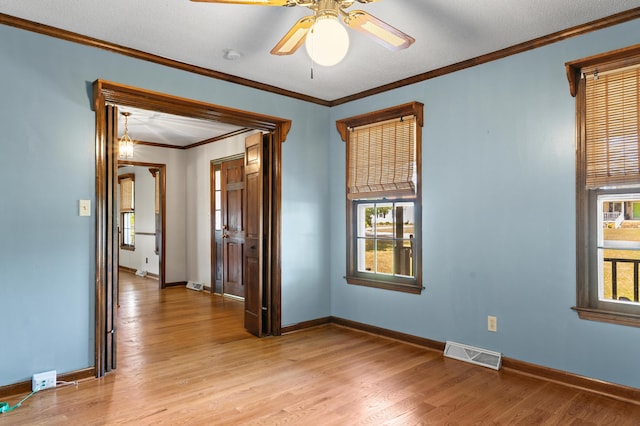 4075 Brown St, Orangeburg, SC 29118 - empty room with light wood-style floors, crown molding, baseboards, and a ceiling fan