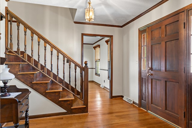4075 Brown St, Orangeburg, SC 29118 - entryway with wood finished floors, stairs, ornamental molding, and baseboards
