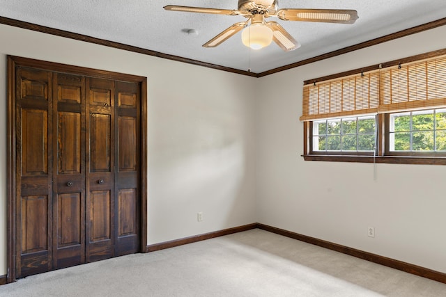 4075 Brown St, Orangeburg, SC 29118 - unfurnished bedroom featuring light carpet, baseboards, ornamental molding, a ceiling fan, and a closet