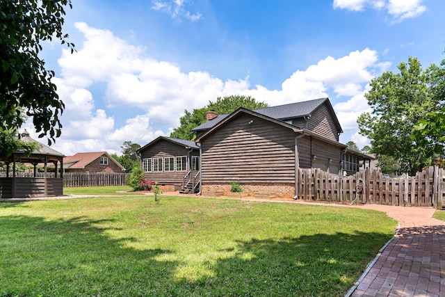 4075 Brown St, Orangeburg, SC 29118 - view of home's exterior featuring a chimney and a gazebo
