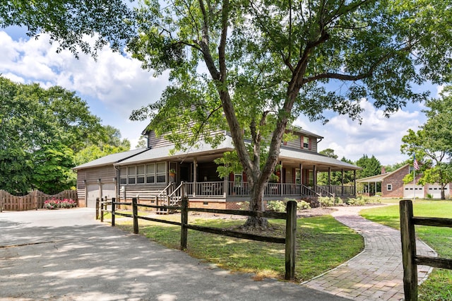 4075 Brown St, Orangeburg, SC 29118 - country-style home with a porch, an attached garage, and driveway