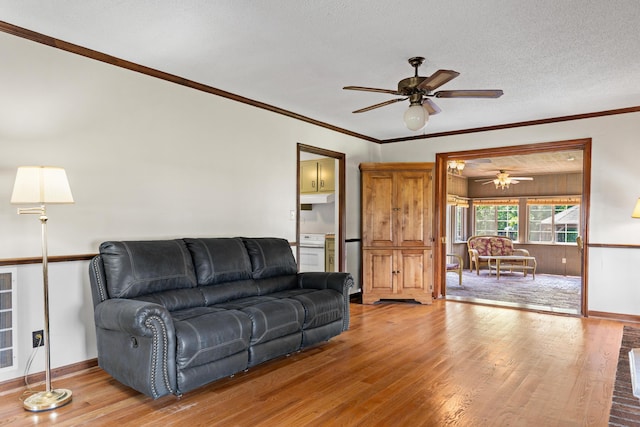 4075 Brown St, Orangeburg, SC 29118 - living area with ceiling fan, wood finished floors, baseboards, ornamental molding, and a textured ceiling
