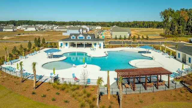 view of pool with a pergola and a patio area