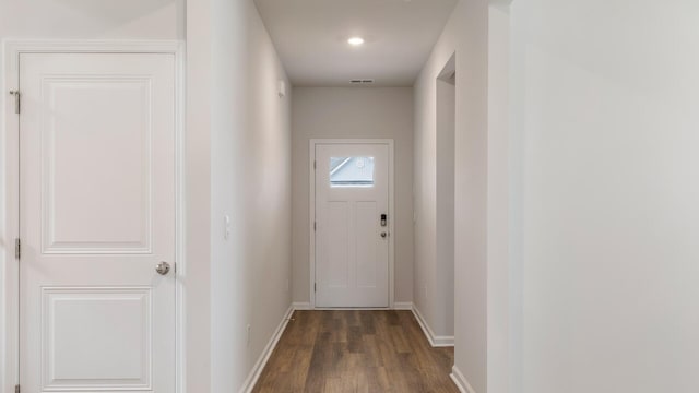 doorway with dark wood-type flooring