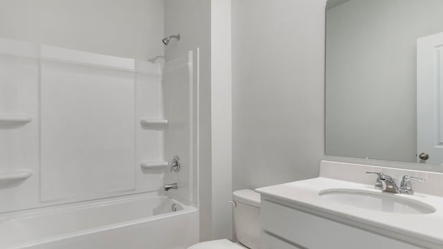 full bathroom featuring vanity,  shower combination, and toilet