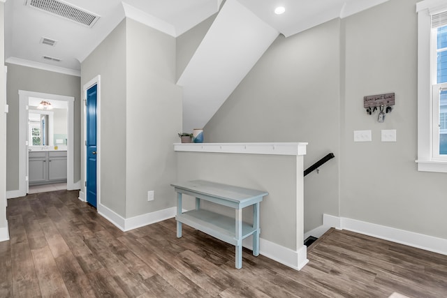 interior space with crown molding and hardwood / wood-style flooring