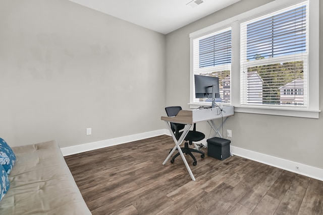 office space featuring dark wood-type flooring and plenty of natural light