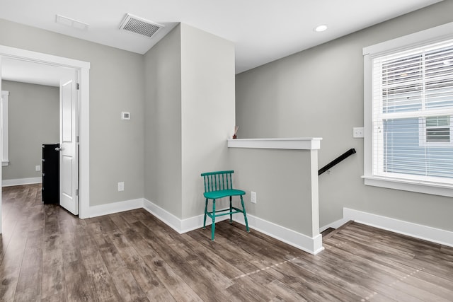 interior space featuring dark hardwood / wood-style floors and a healthy amount of sunlight