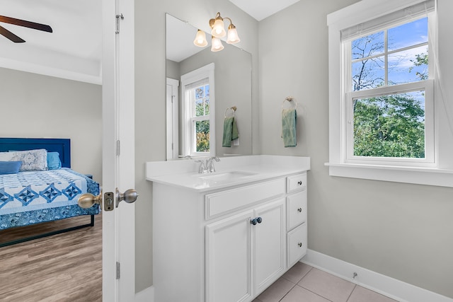 bathroom featuring vanity, hardwood / wood-style flooring, plenty of natural light, and ceiling fan