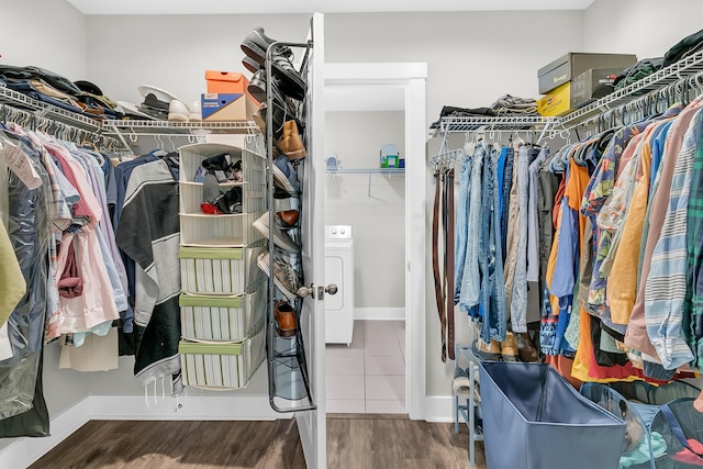 walk in closet featuring washer / clothes dryer and wood-type flooring