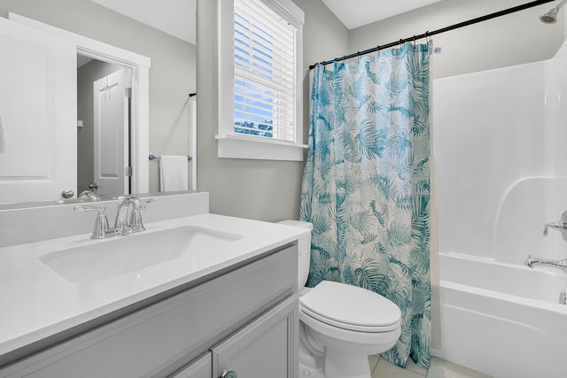 full bathroom featuring vanity, shower / tub combo with curtain, toilet, and tile patterned floors