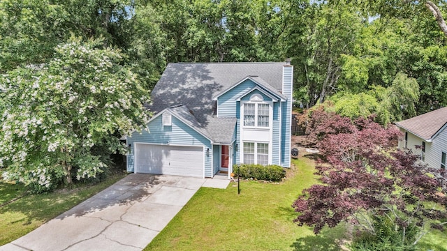2773 Forest Dew Ct, Charleston, SC 29414 - view of front of house with driveway, a chimney, a front lawn, a garage, and roof with shingles
