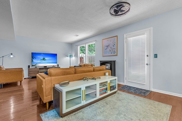 2773 Forest Dew Ct, Charleston, SC 29414 - living area with a textured ceiling and wood finished floors