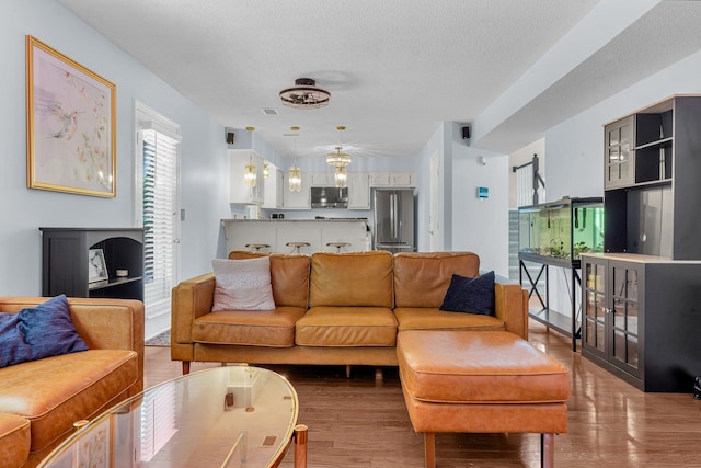 2773 Forest Dew Ct, Charleston, SC 29414 - living area featuring wood finished floors and a textured ceiling