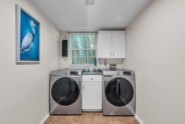2773 Forest Dew Ct, Charleston, SC 29414 - washroom with washer / clothes dryer, cabinet space, and light tile patterned flooring