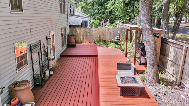 2773 Forest Dew Ct, Charleston, SC 29414 - deck with a fenced backyard, a fire pit, and area for grilling