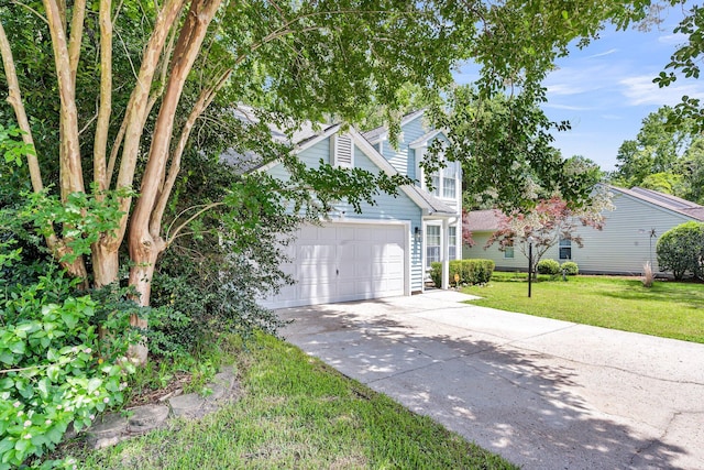 2773 Forest Dew Ct, Charleston, SC 29414 - view of front of house featuring driveway, a front lawn, and an attached garage