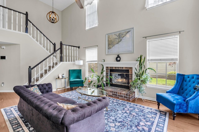 2773 Forest Dew Ct, Charleston, SC 29414 - living room with a towering ceiling, plenty of natural light, wood finished floors, and stairway
