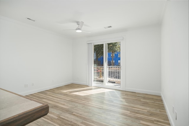 empty room featuring light wood-type flooring, ceiling fan, and ornamental molding