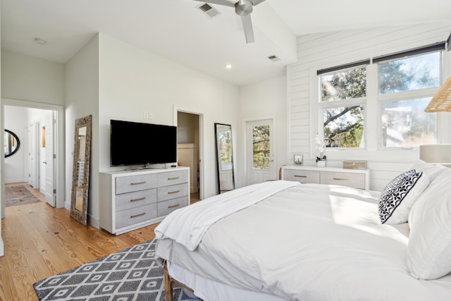 bedroom with lofted ceiling, ceiling fan, and light hardwood / wood-style flooring