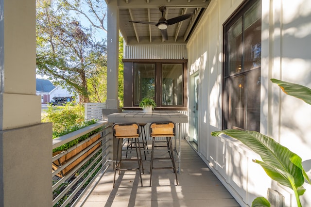 balcony featuring ceiling fan