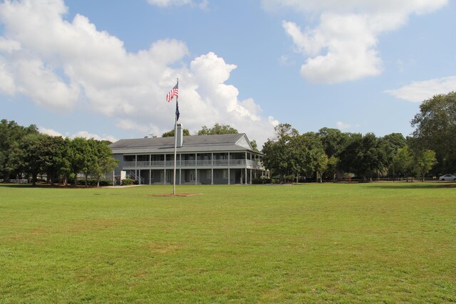 view of home's community featuring a yard