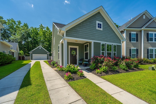 1607 Roustabout Way, Charleston, SC 29414 - view of front of home with a garage, a front yard, an outdoor structure, and covered porch