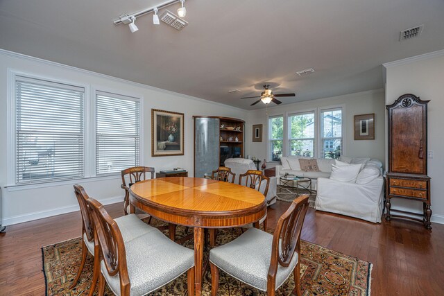 1607 Roustabout Way, Charleston, SC 29414 - dining area featuring crown molding, ceiling fan, wood finished floors, and rail lighting