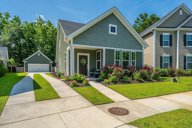 1607 Roustabout Way, Charleston, SC 29414 - view of front of property featuring an outbuilding, a detached garage, a front lawn, and covered porch