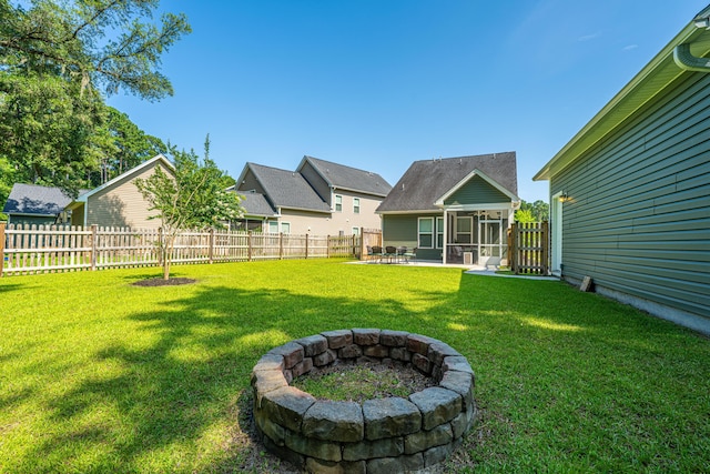 1607 Roustabout Way, Charleston, SC 29414 - fenced backyard featuring a sunroom, an outdoor fire pit, and a patio