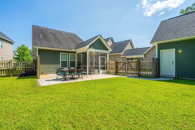 1607 Roustabout Way, Charleston, SC 29414 - back of house featuring a patio area, a fenced backyard, a gate, and a sunroom