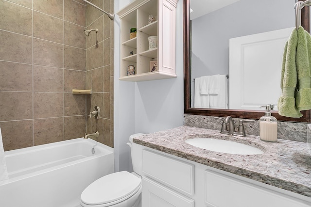 bathroom featuring vanity, toilet, and tub / shower combination