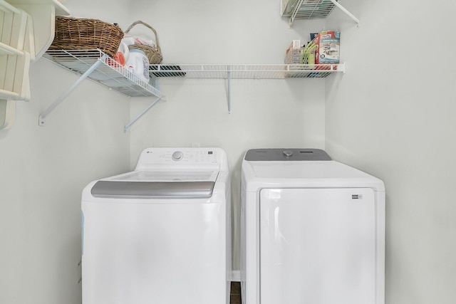 washroom featuring washing machine and dryer and laundry area